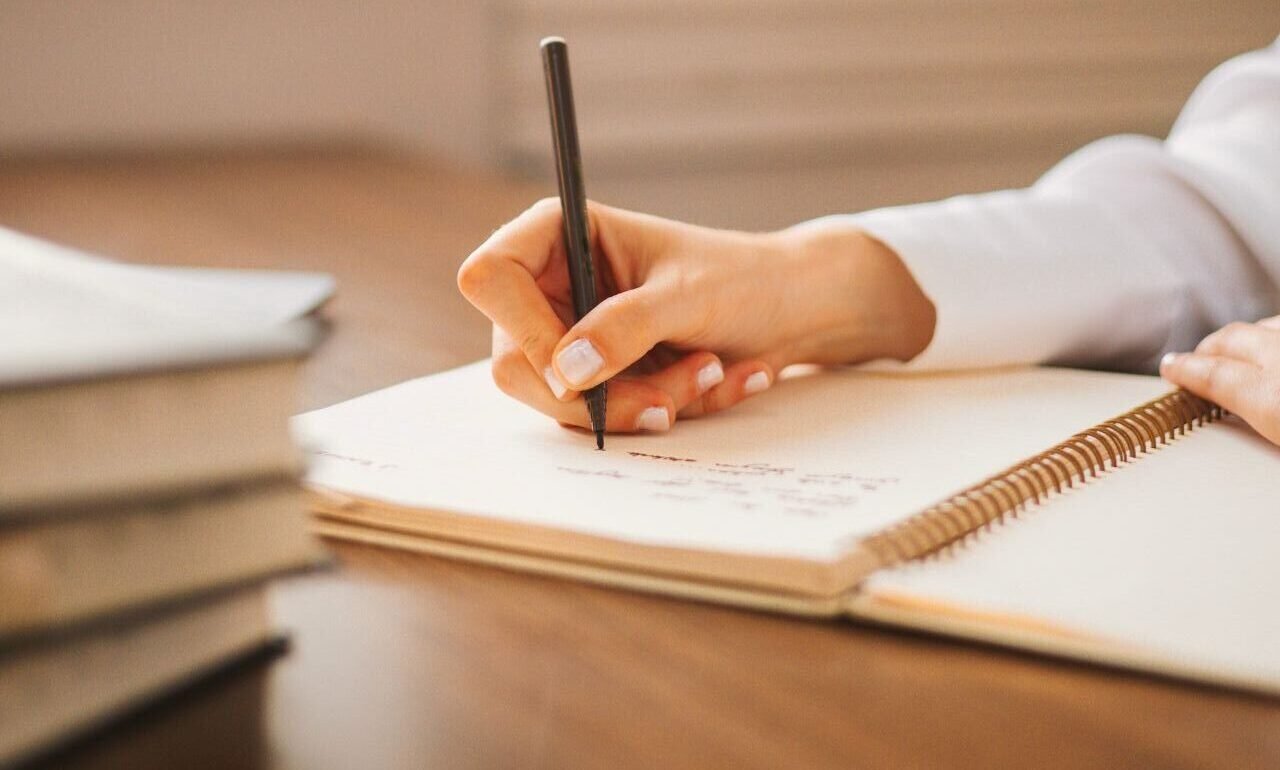 Woman writing in a journal