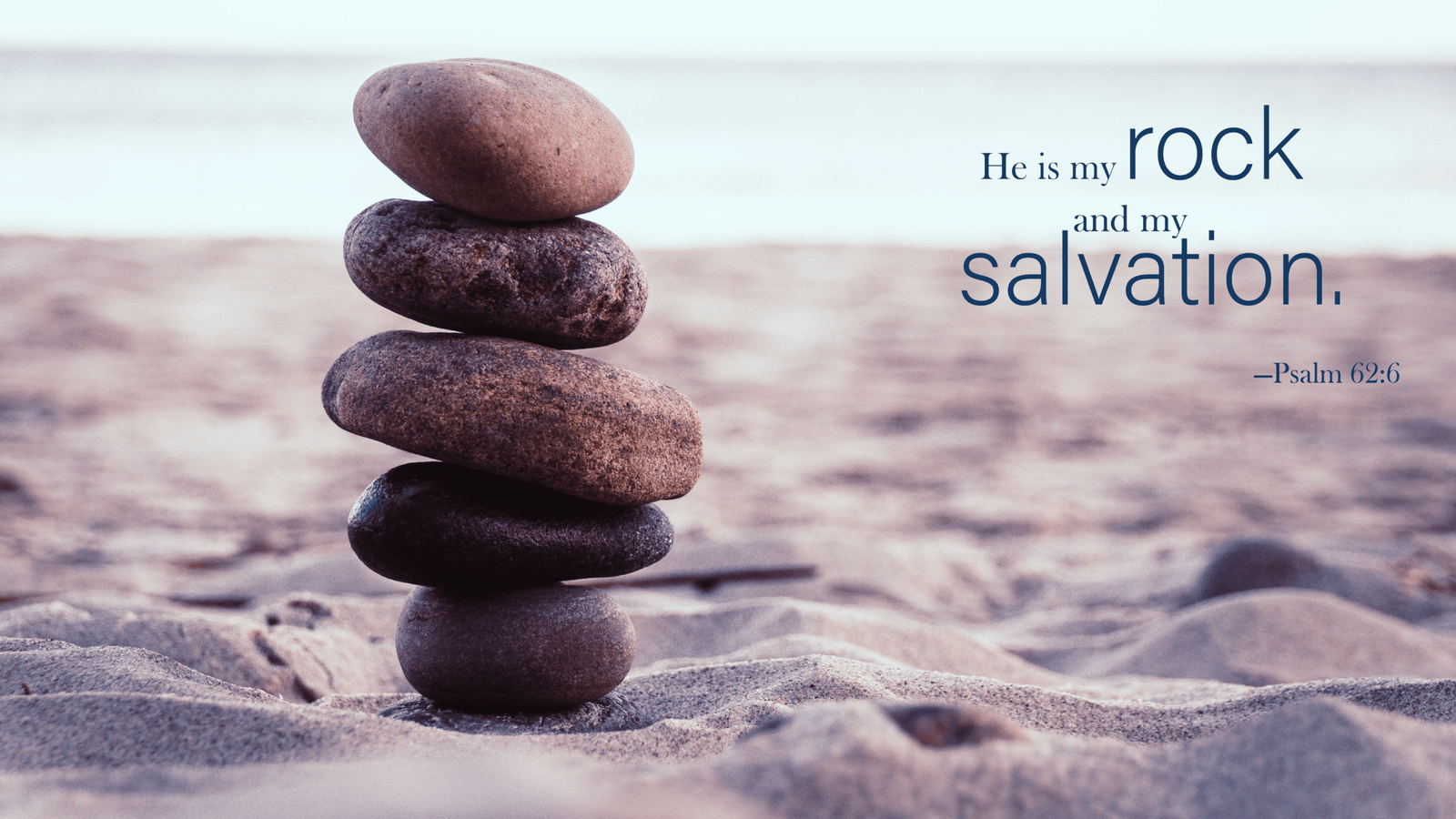Stack of rock on a beach with Psalm 62:6 verse